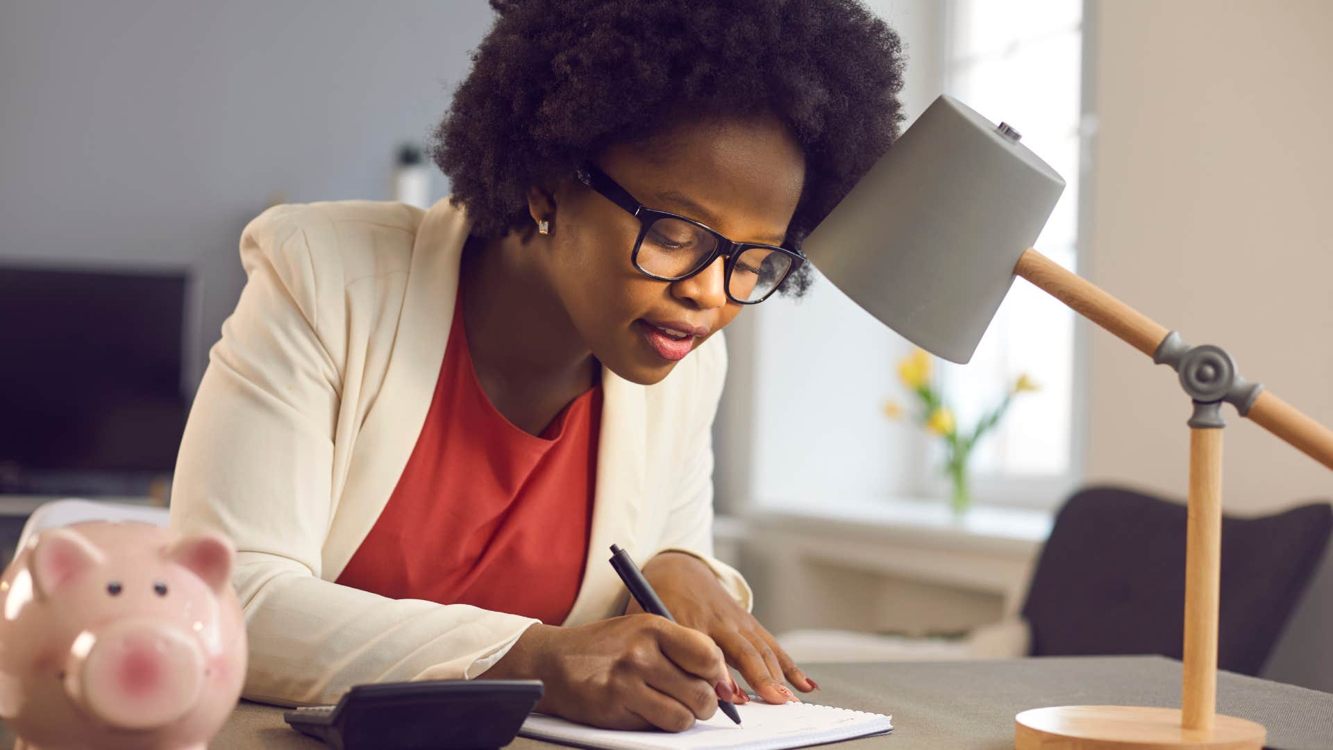 woman tracking her spending sitting at desk