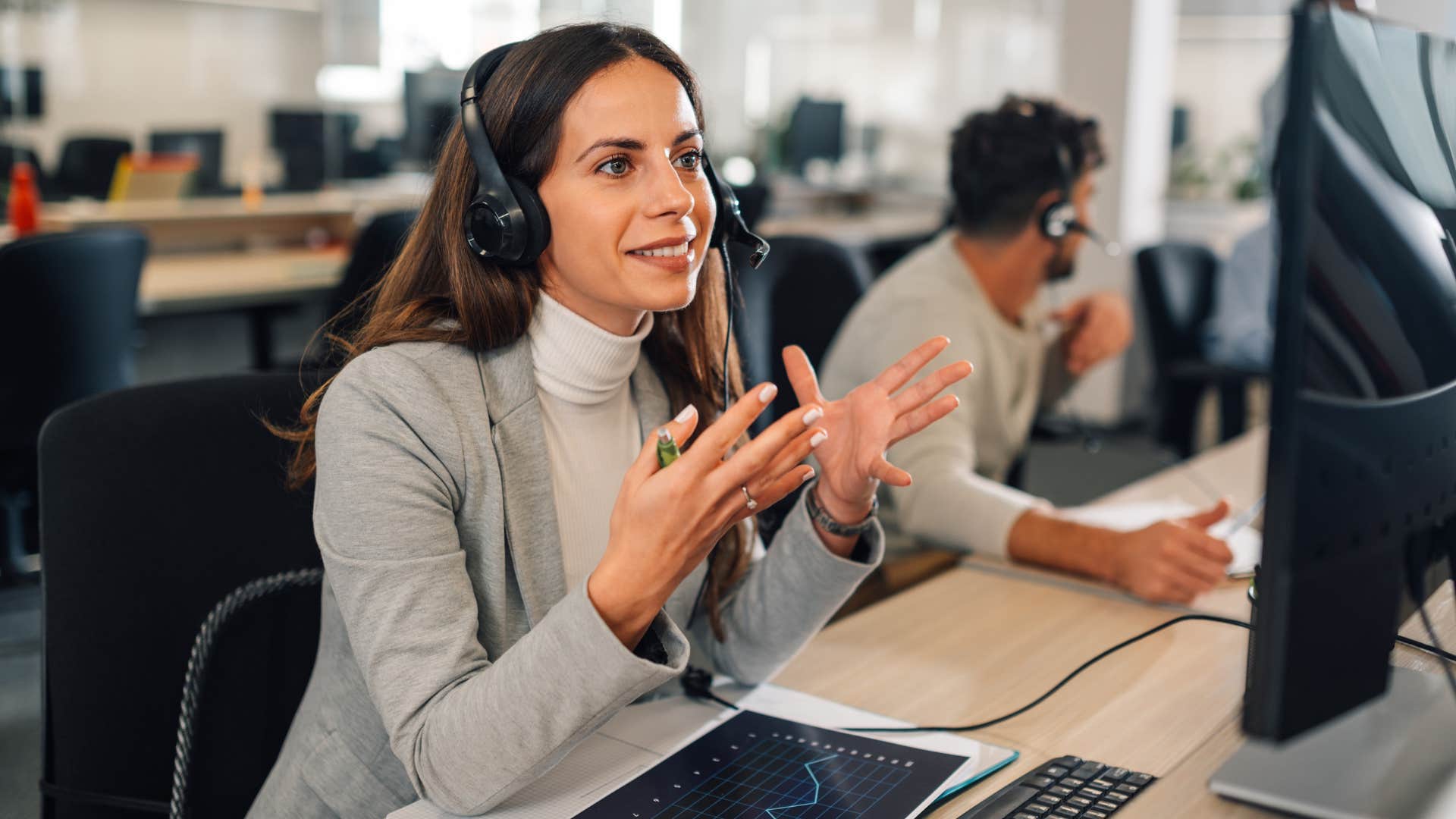 Woman talking to someone on a headset at work