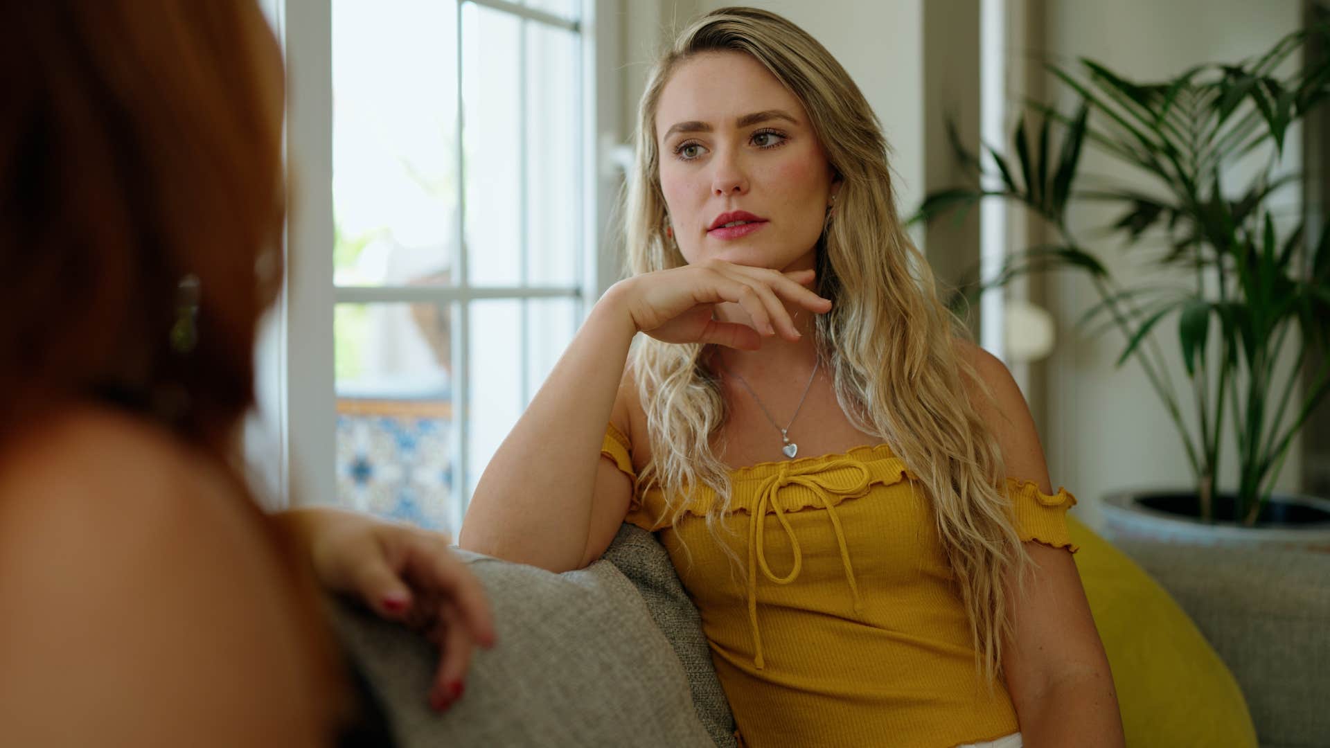 young woman talking to her friend