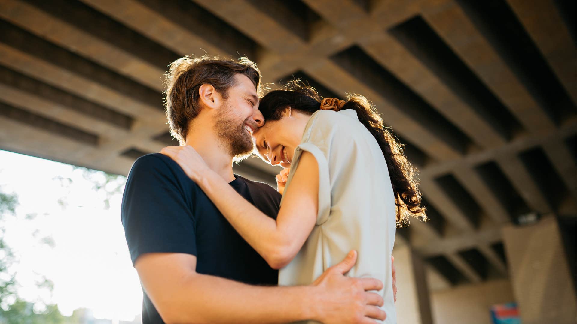 couple embraces feeling safe and vulnerable with each other