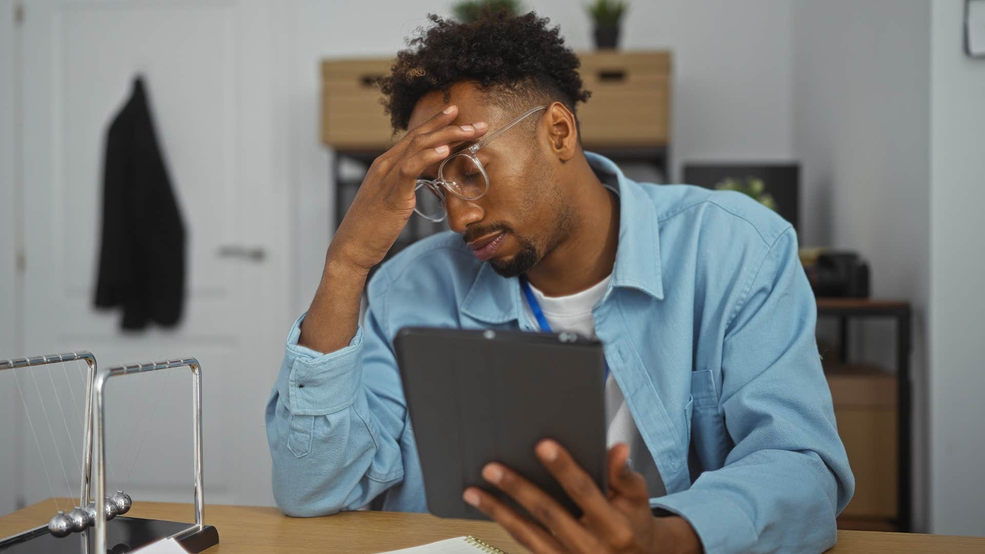 Stressed man sitting at his desk