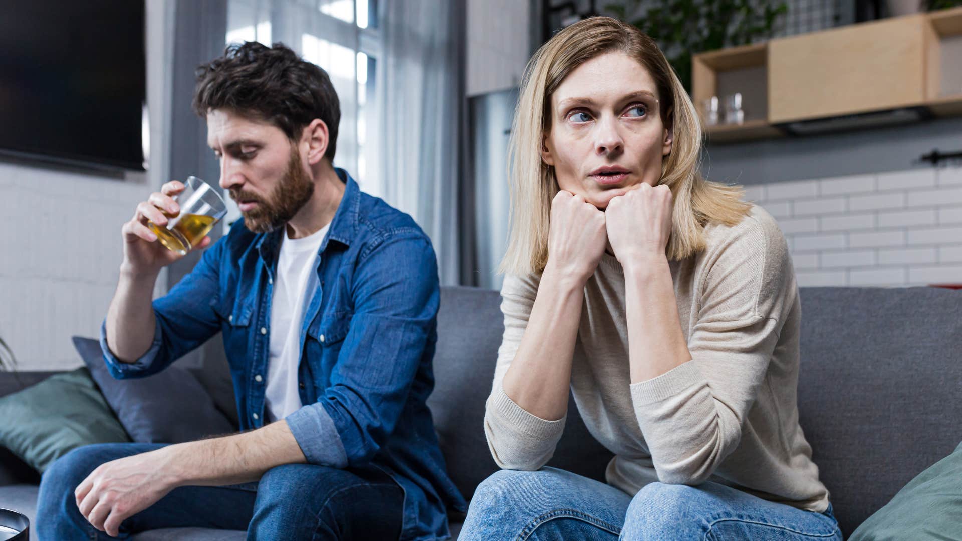 couple sitting on couch in living room