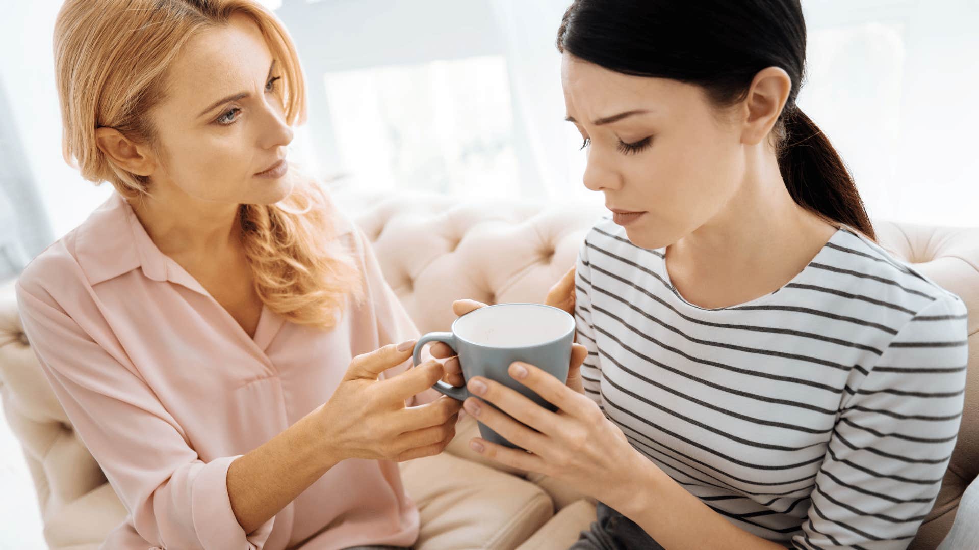 woman comforting friend
