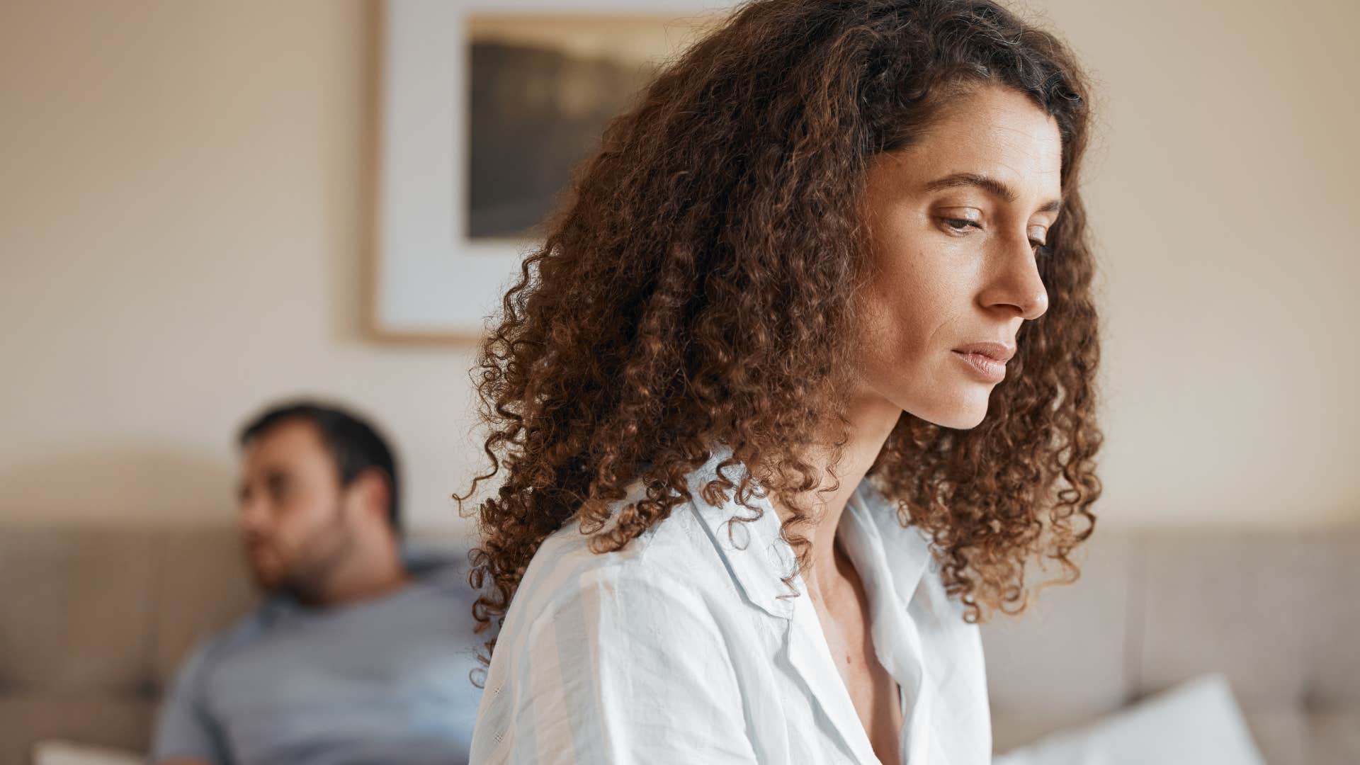 sad woman turned away from her husband