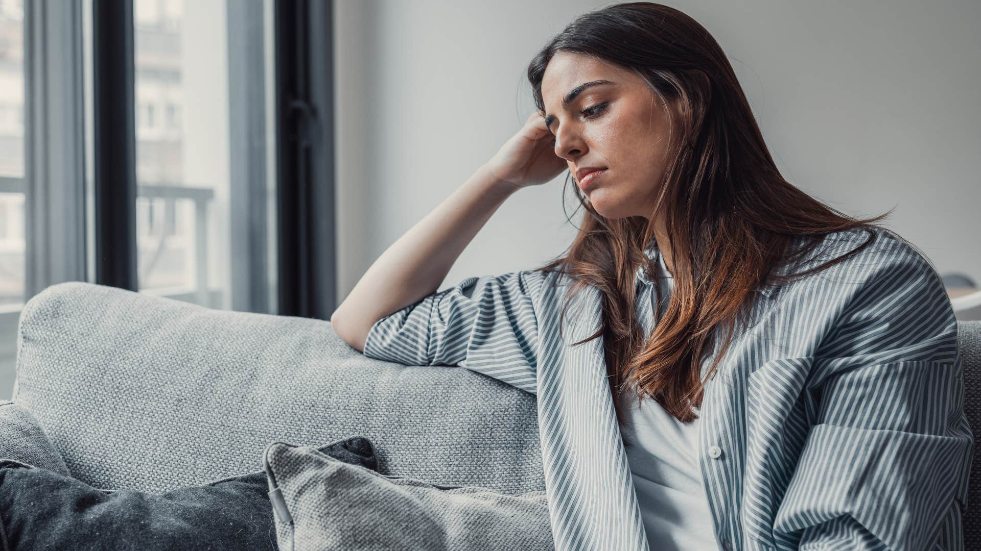 sad shy woman sitting thinking