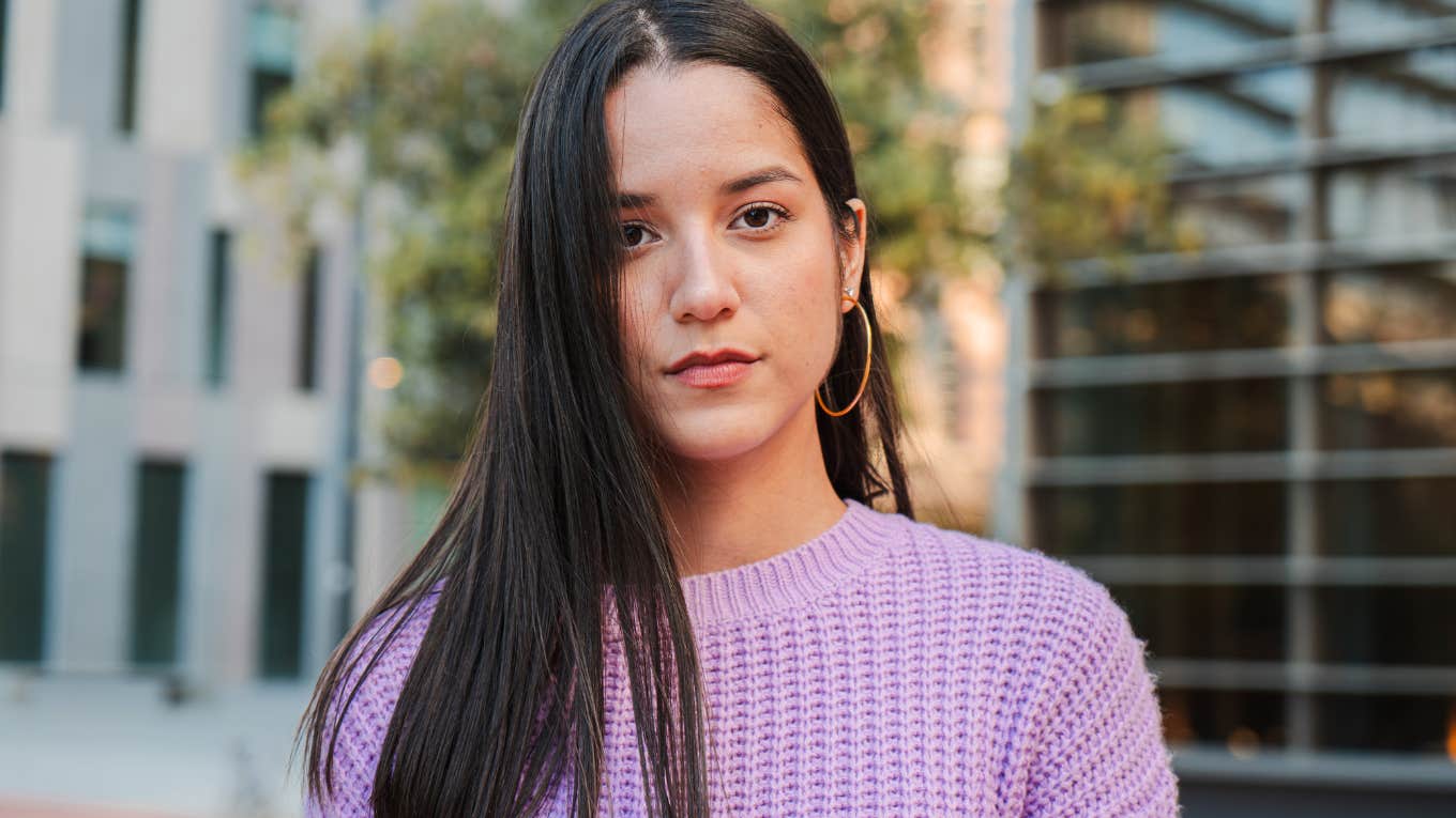 Things Gen Z Girls Were Taught Growing Up That Turned Out To Be Completely Wrong serious Gen Z woman staring
