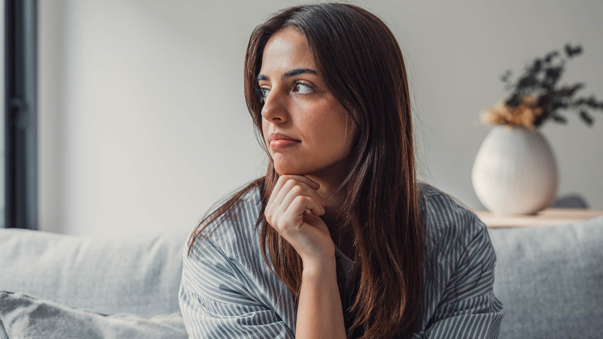 Calm high value woman looking away from the camera