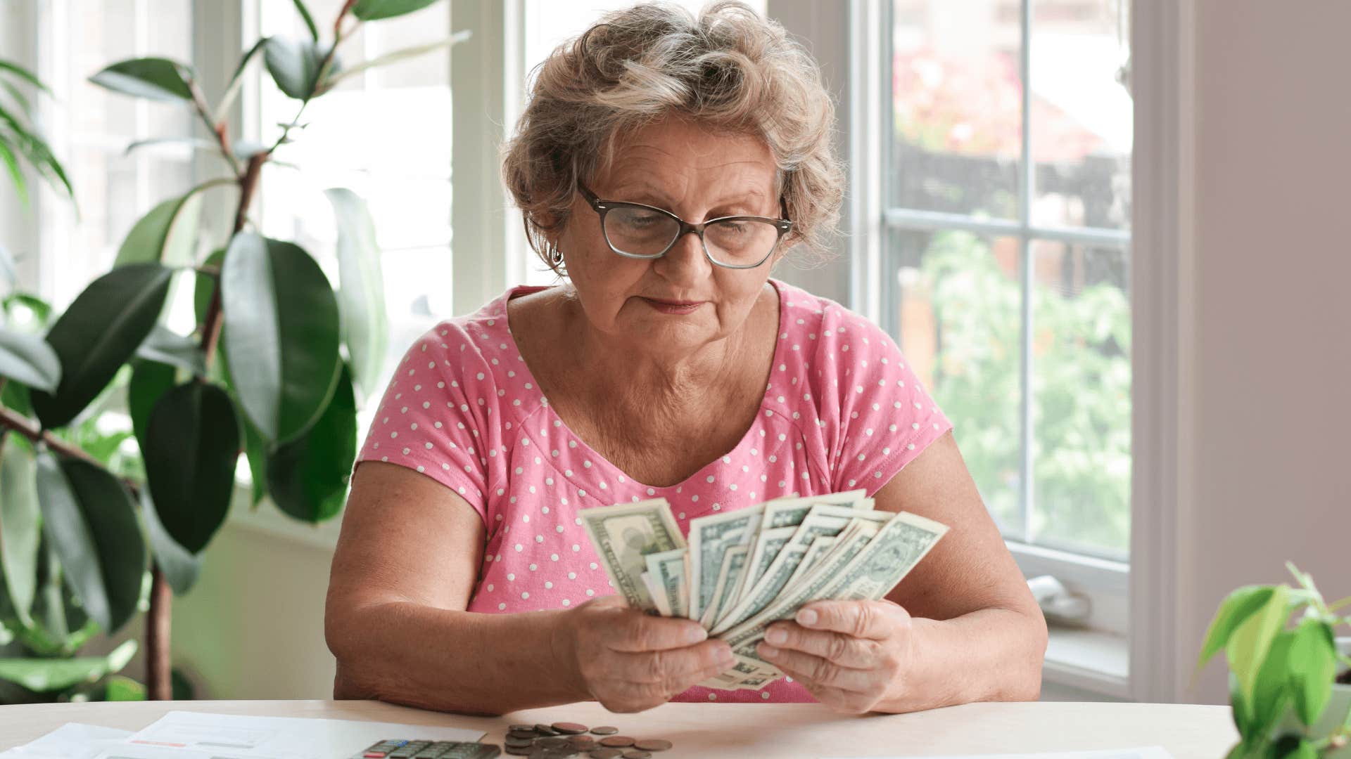 boomer woman counting cash