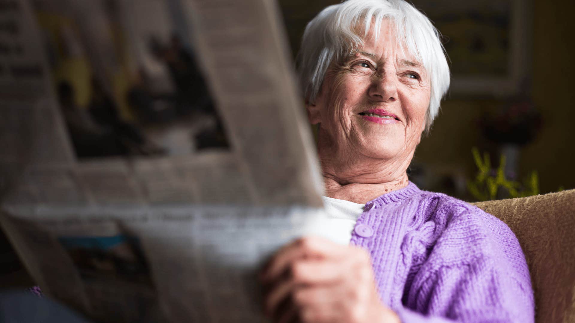 boomer woman reading the newspaper