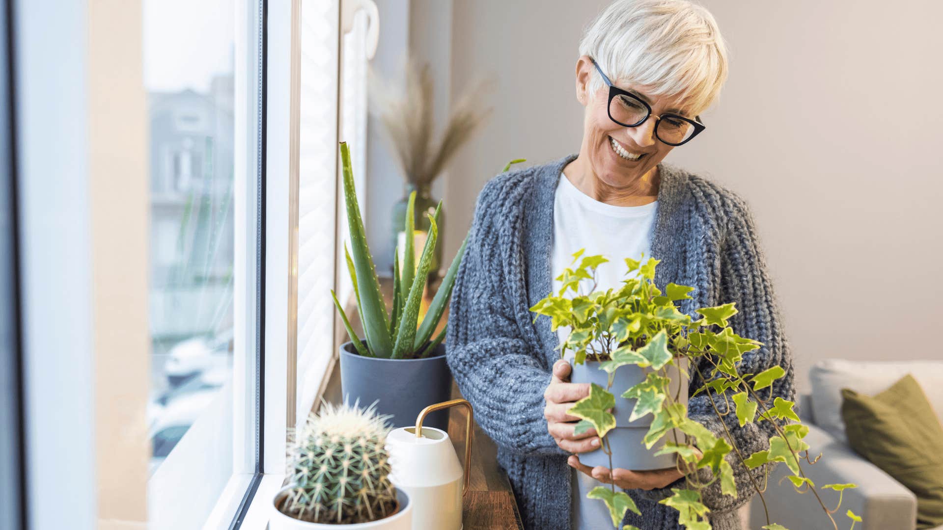 boomer woman holding a house plant