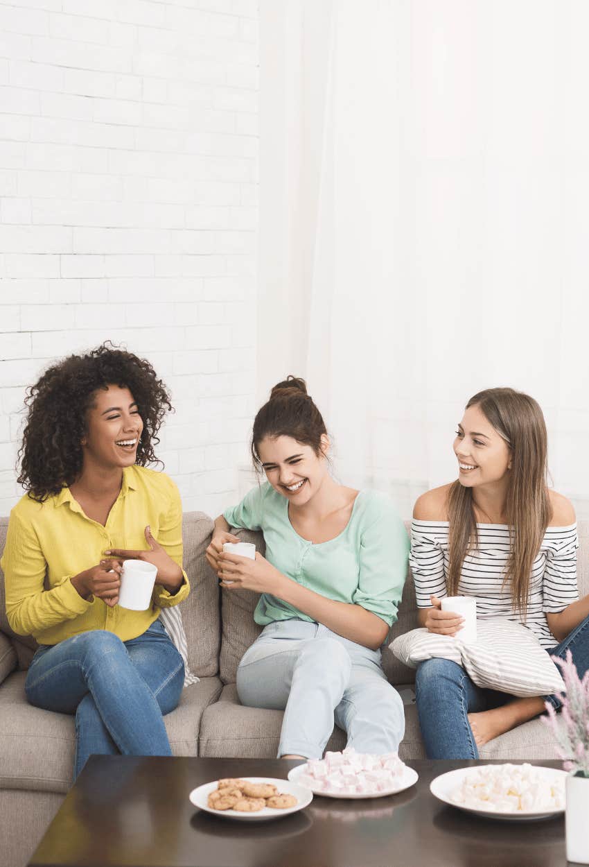 Roommates enjoying spending time together proving household size impacts happiness