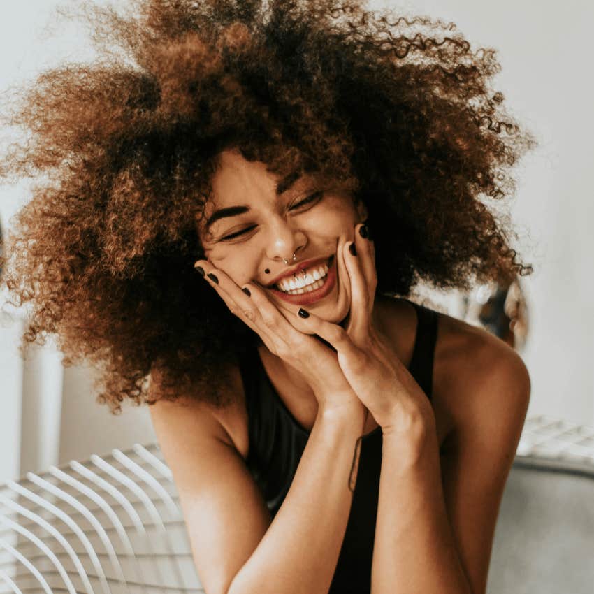 smiling woman who knows backwards rule to wealth and popularity