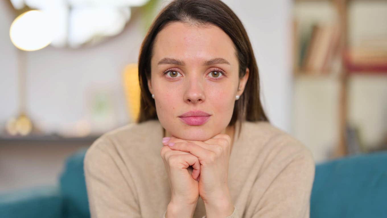 Behaviors People Think Are Self-Aware, But Are Really Just Rude young self-aware woman with hands on her chin