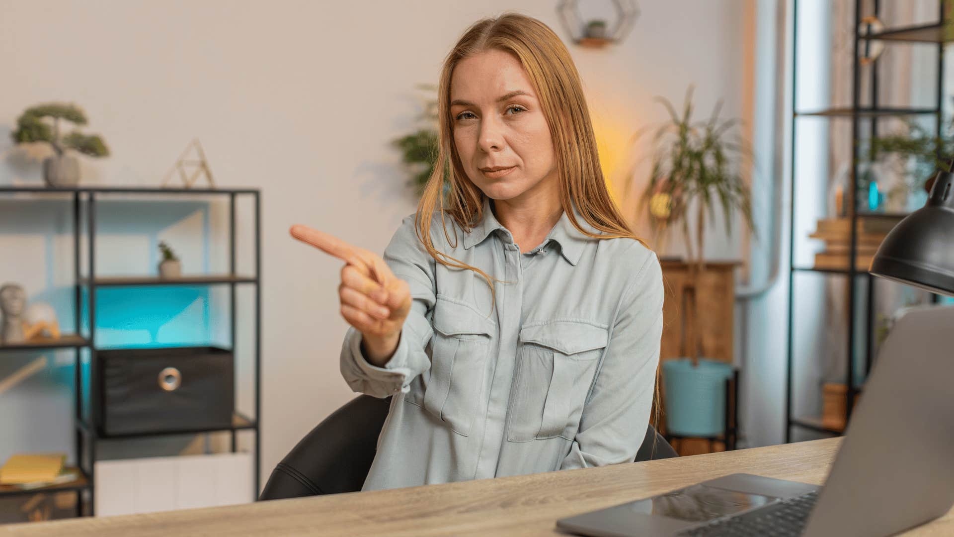 serious woman shaking her finger no