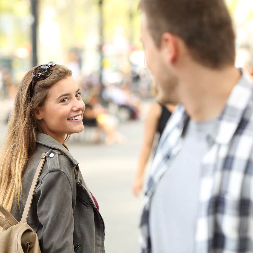 irresistible confident woman looking at man
