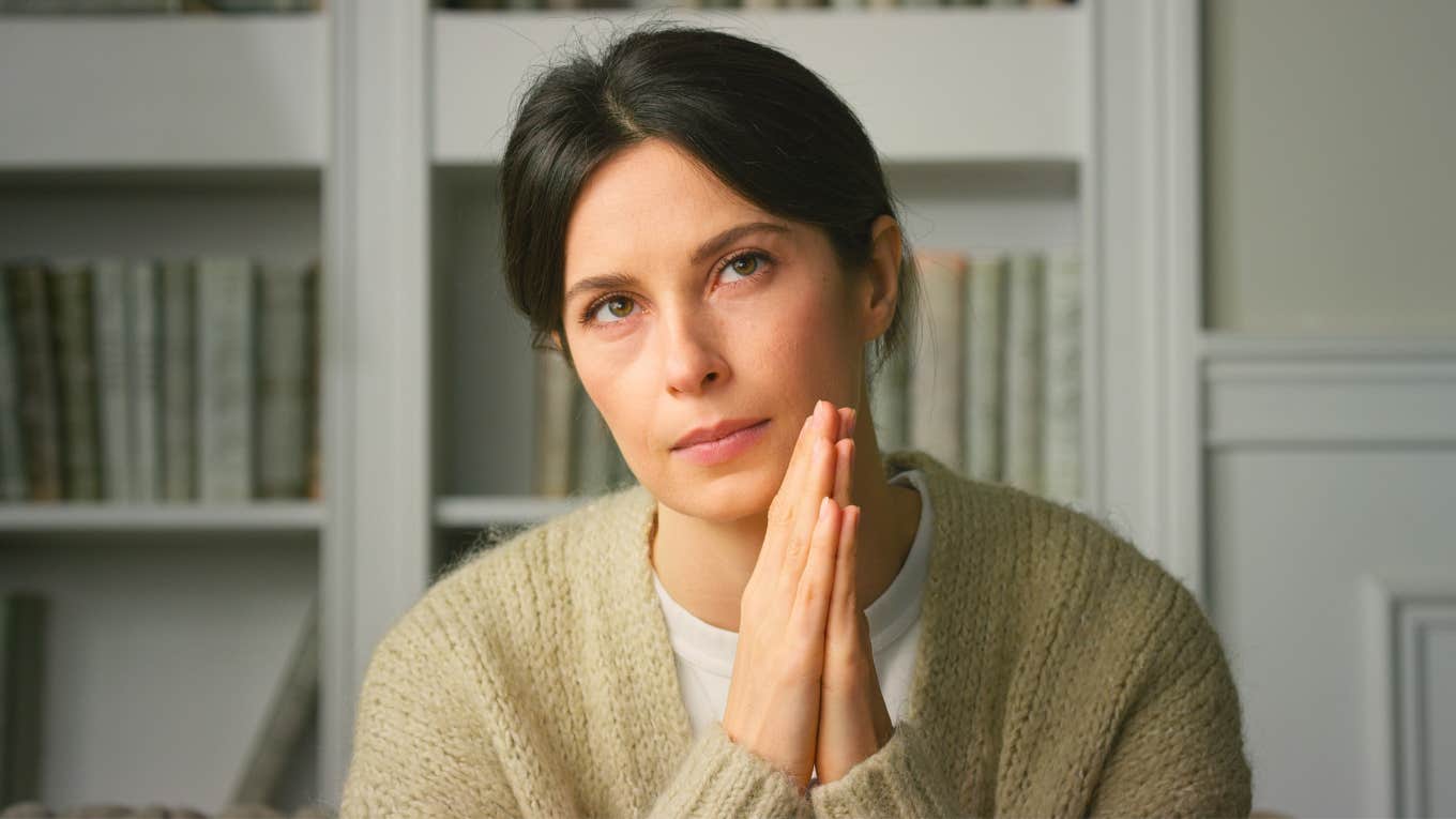 Behaviors That Seem Nice But Actually Scream Low Self-Worth unconfident woman with her hands touching