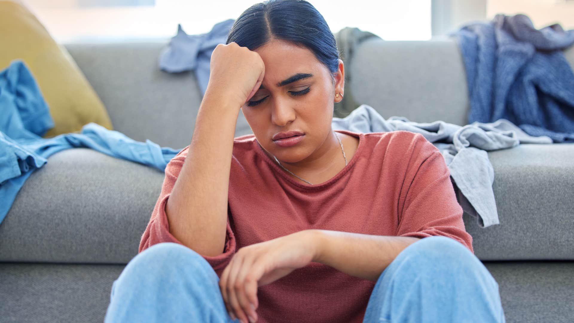 overwhelmed woman sitting on floor Not initiating conversations