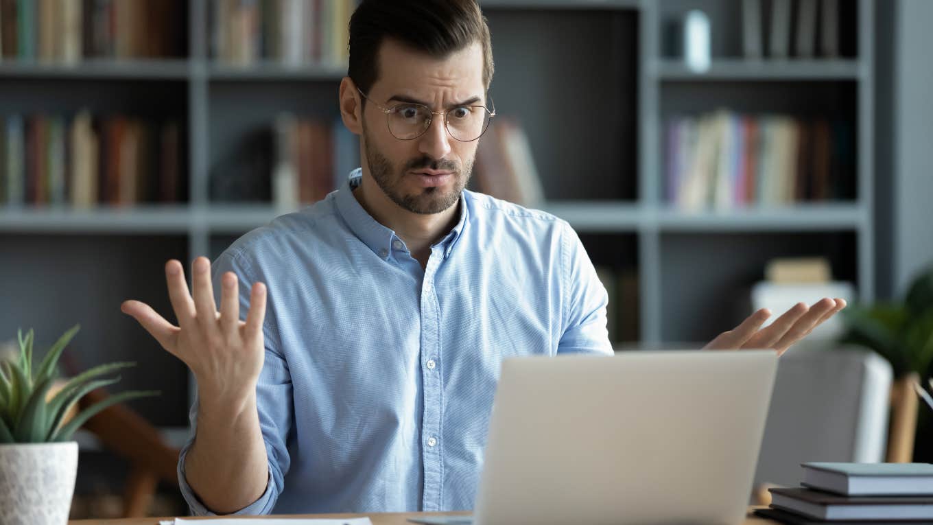 Boss Gives New Worker Personality Test With Embarrassing Results employee looking at embarrassing personality test results