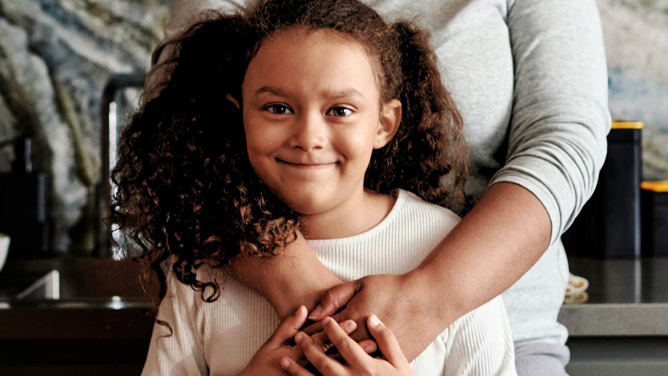 Clues You’ve Raised Your Kids Well—Even If They Haven’t Thanked You Yet Child raised well, embraced by her mother's arms.