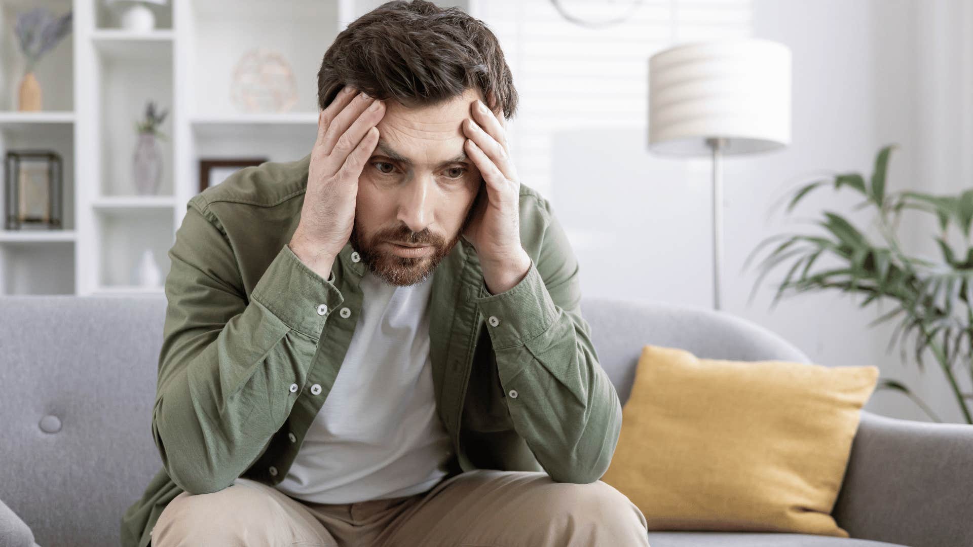 anxious man sitting on couch