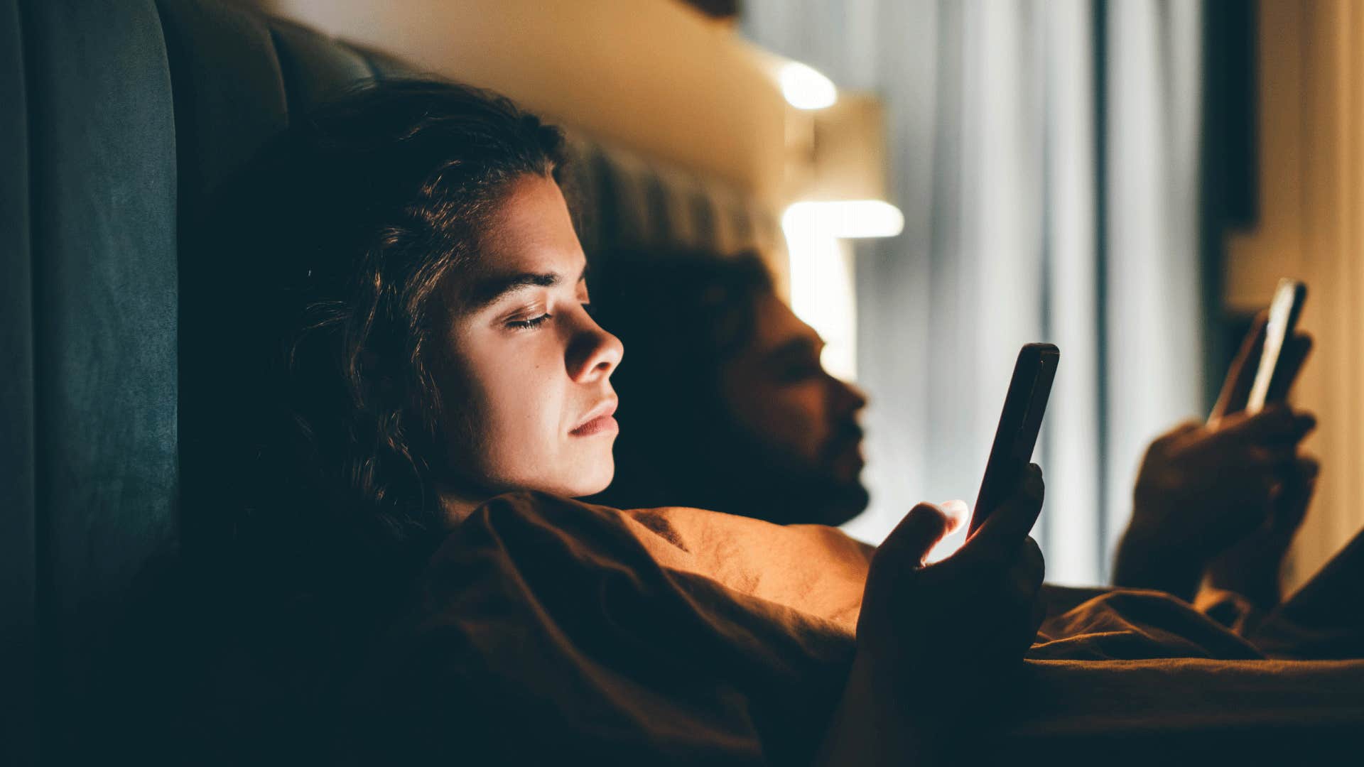 couple in bed having a conversation about ai mature content changing landscape intimacy