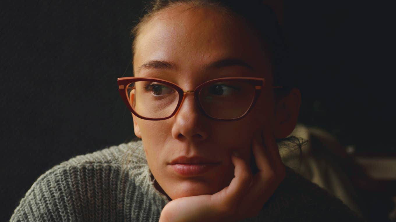 Delayed Red Flags That Only Show Up After You’re Emotionally Invested Emotionally invested woman.