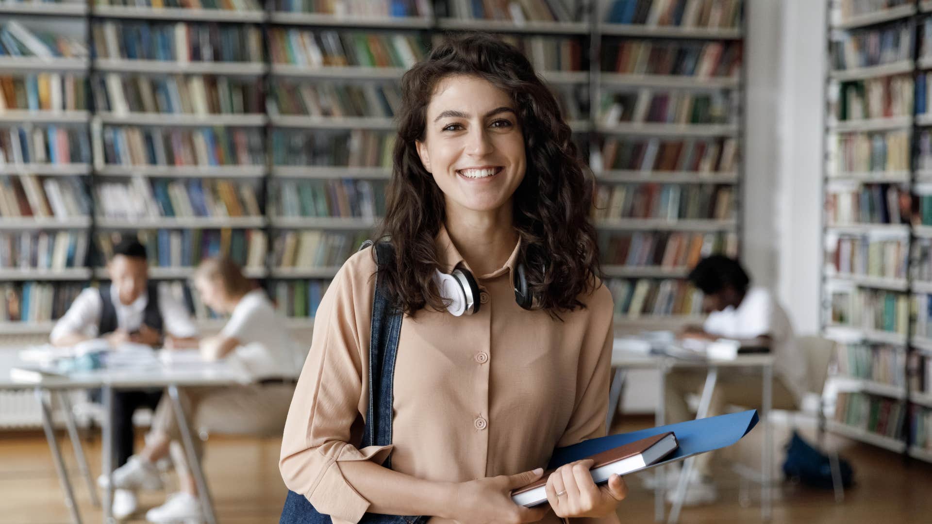 college student smiling in the library