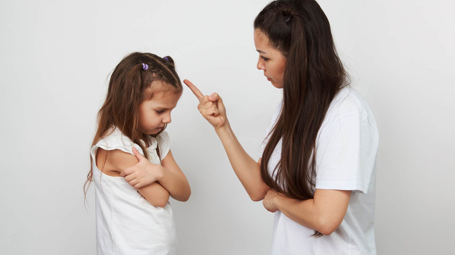 parent disciplining her kid
