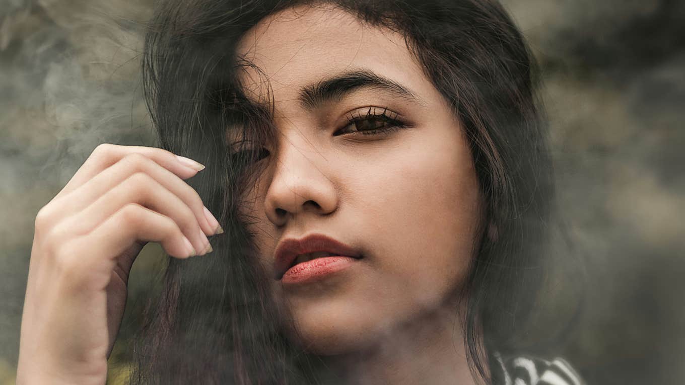 Gen-Z woman shrugs off status symbols.