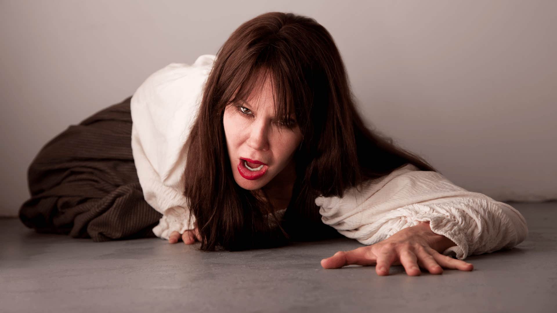 injured woman on the ground screaming