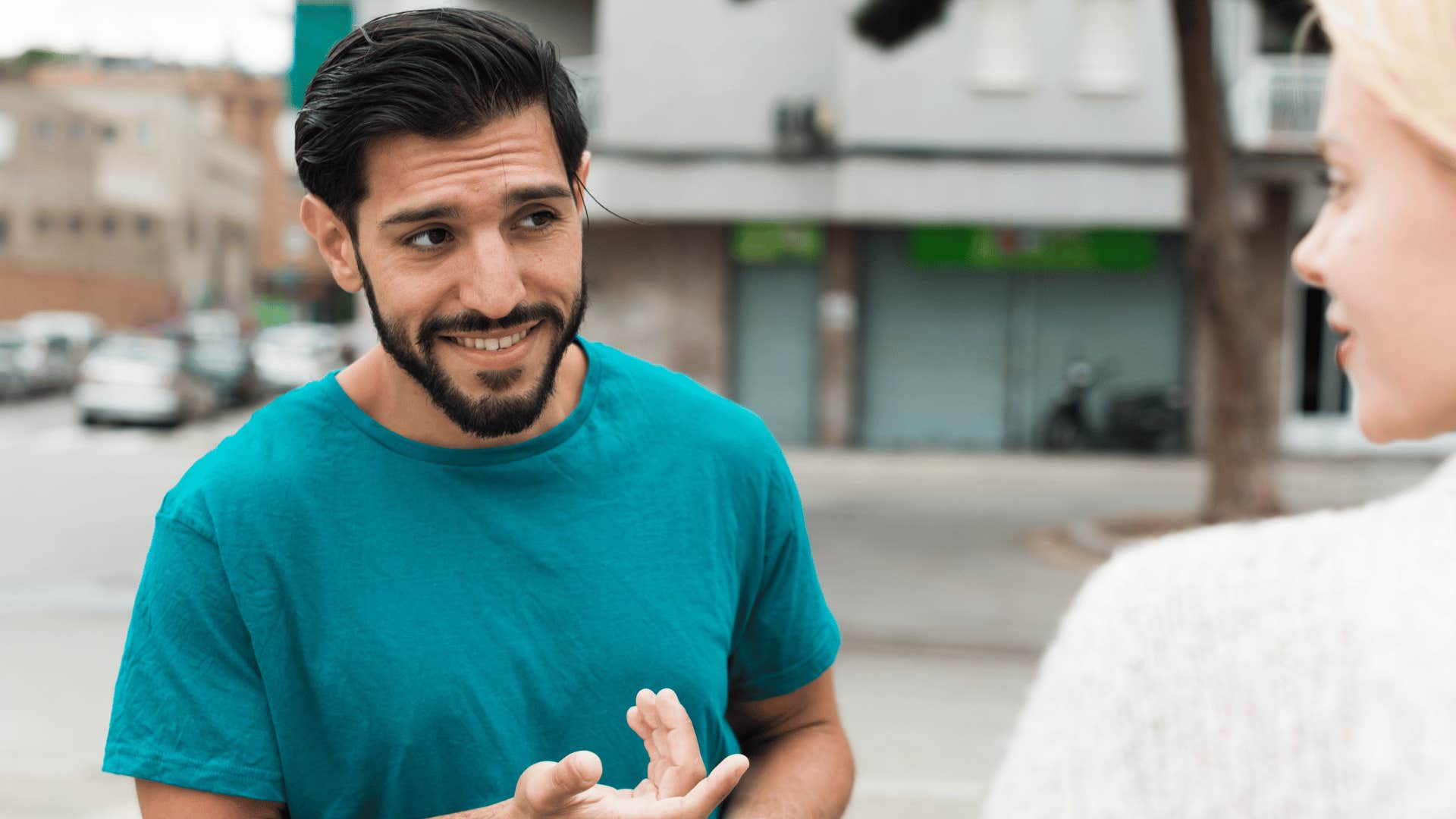 man stopping to talk to woman 