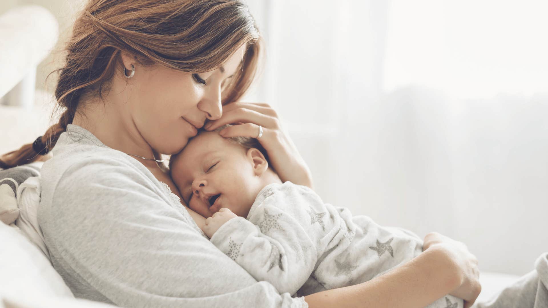 mother holding baby as incredible side effect of being a parent