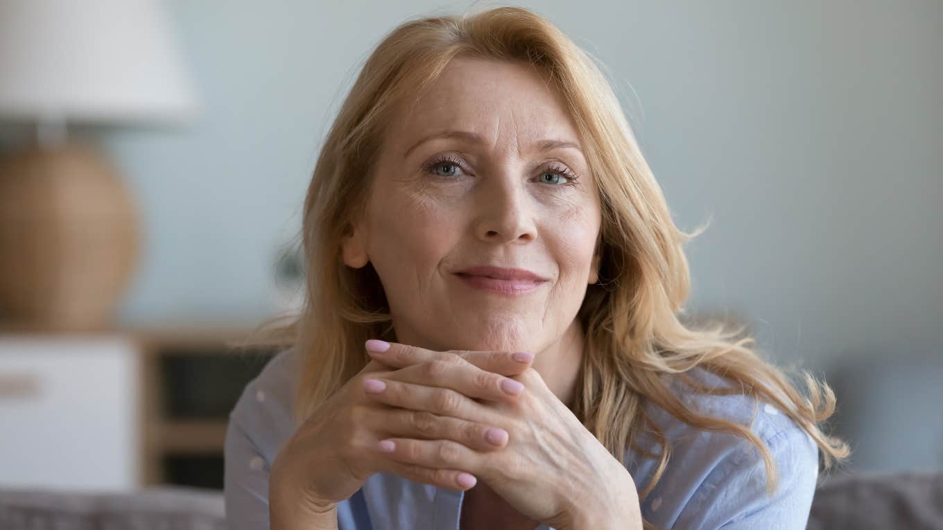 Indoor Hobbies That Are Good For People Who Don't Like To Leave The House introverted woman smiling from her couch