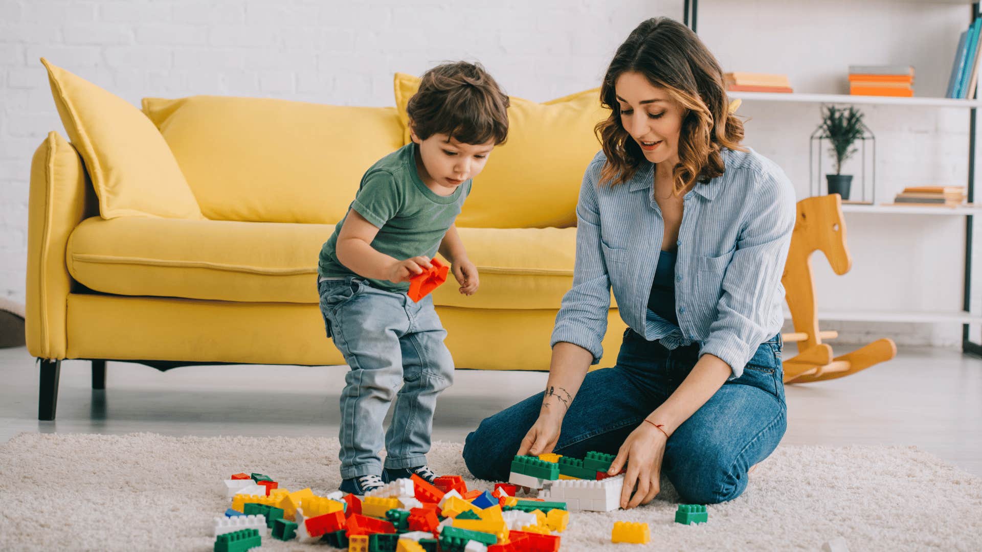 mom and child playing with lego bricks