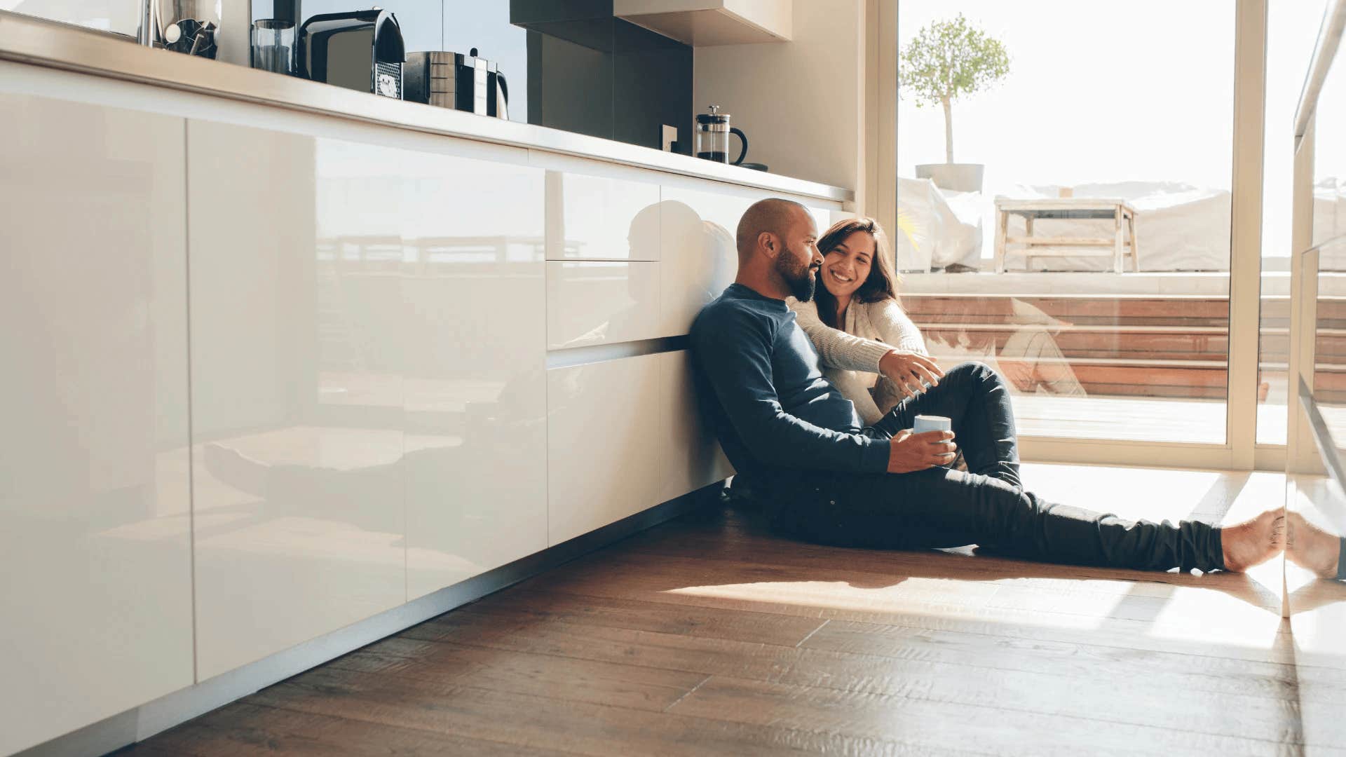 woman sitting next to man on ground thinking wow he's different