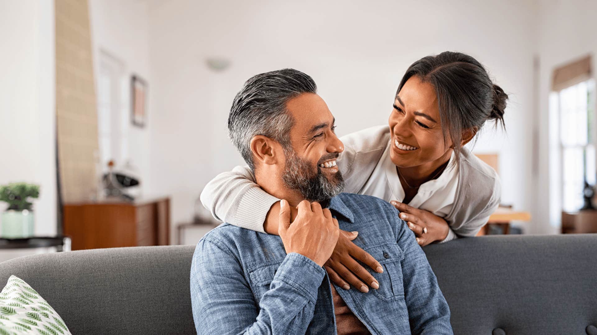 couple smiling at each other as a marriage tip