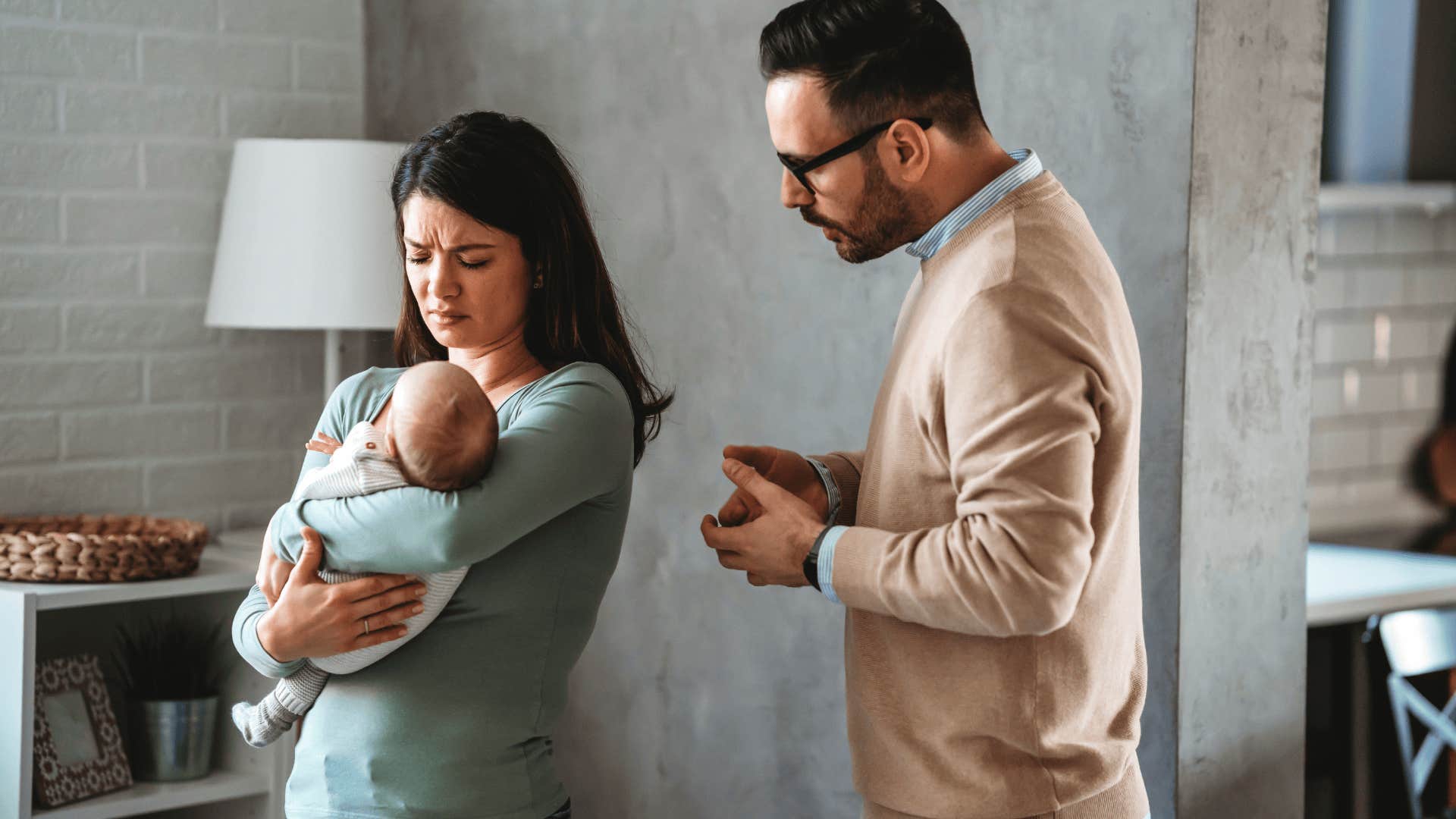 exhausted couple with a baby staying together for life