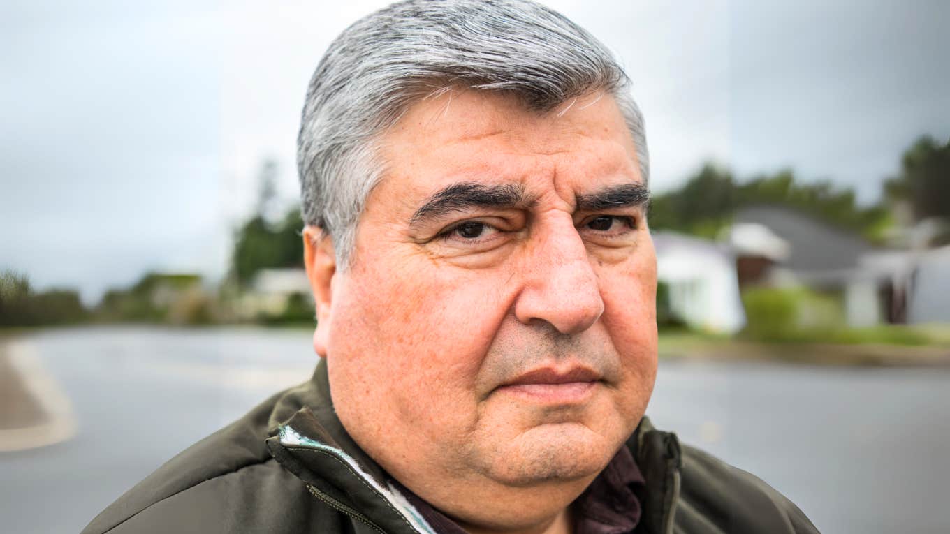 Older man withdrawing from marriage.