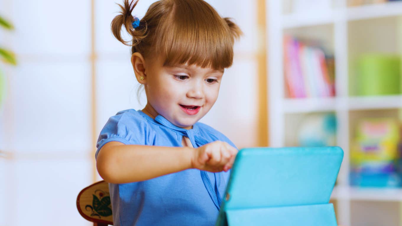Mom Calls Out People Who Are Annoyed By iPad Babies And Kids Just Being Kids little girl on iPad