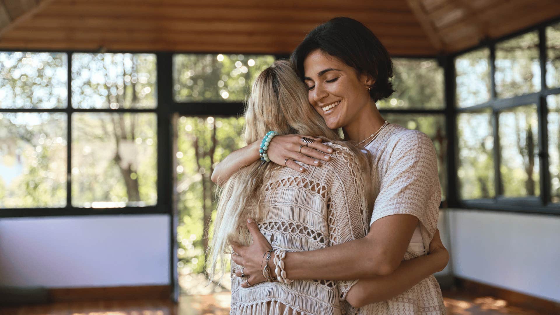 woman hugging inspiring holistic teacher