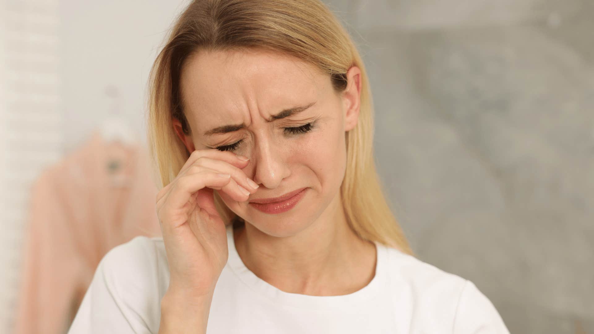 woman crying after first heartbreak