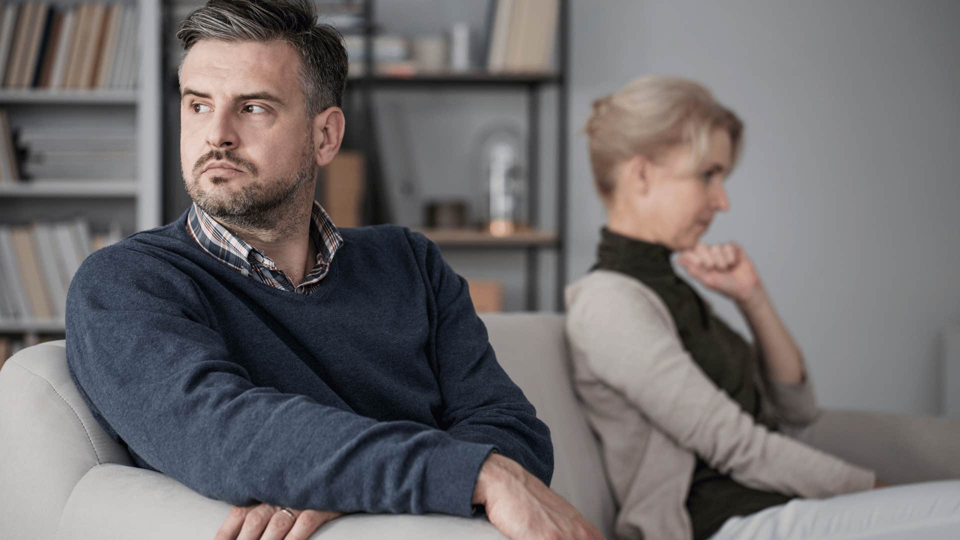 upset couple in therapy as woman complains about husband
