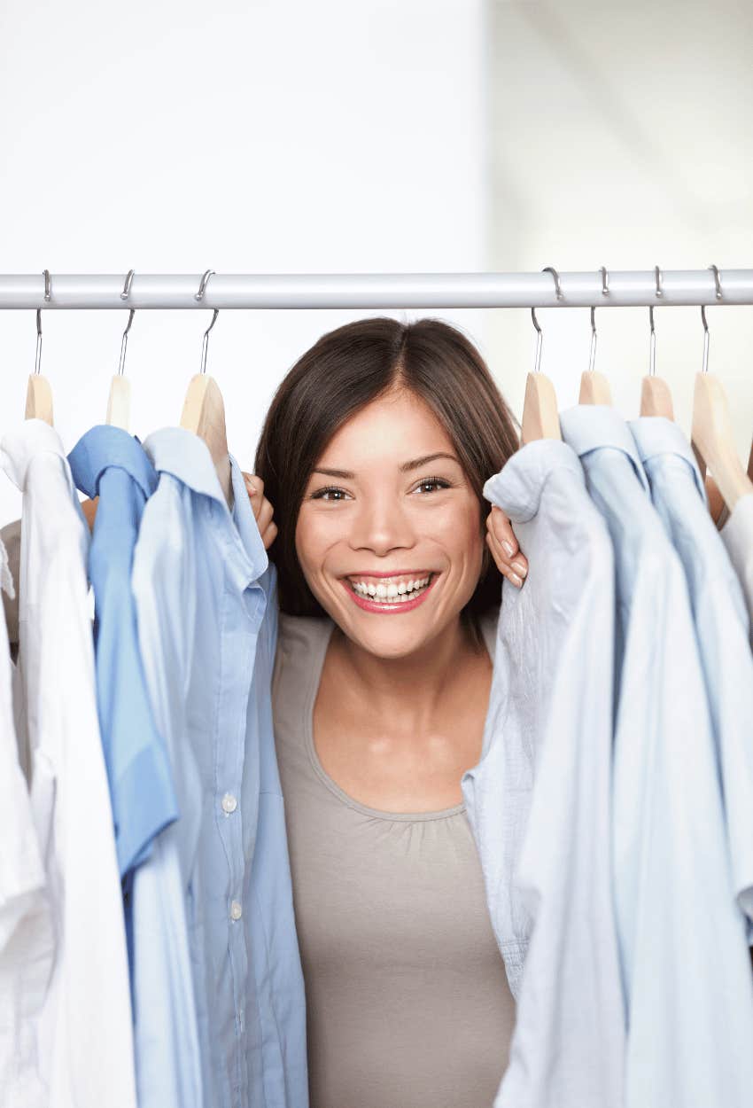 Gen Z woman looking through a clothes that all look the same