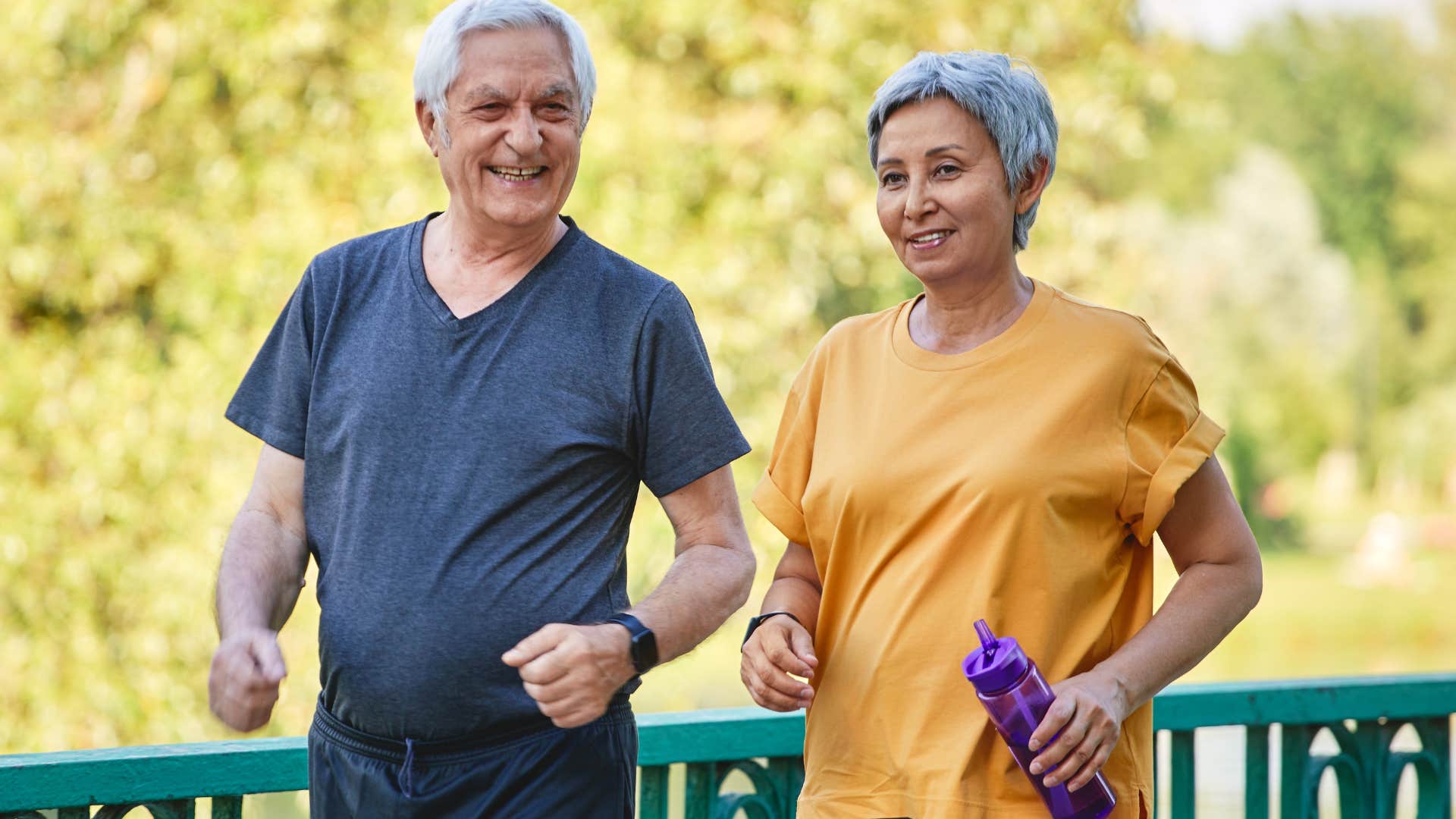 Older couple smiling and walking outside together