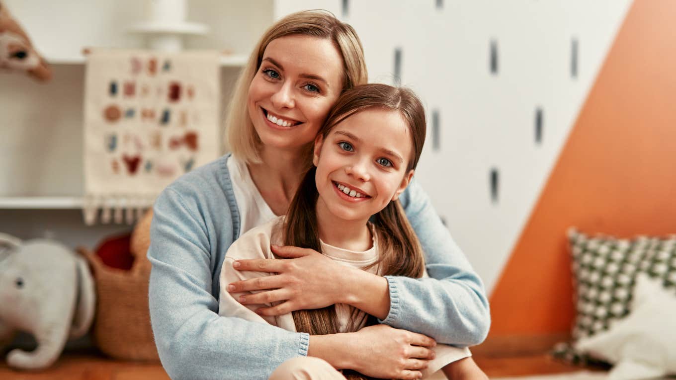 mom hugging resilient daughter