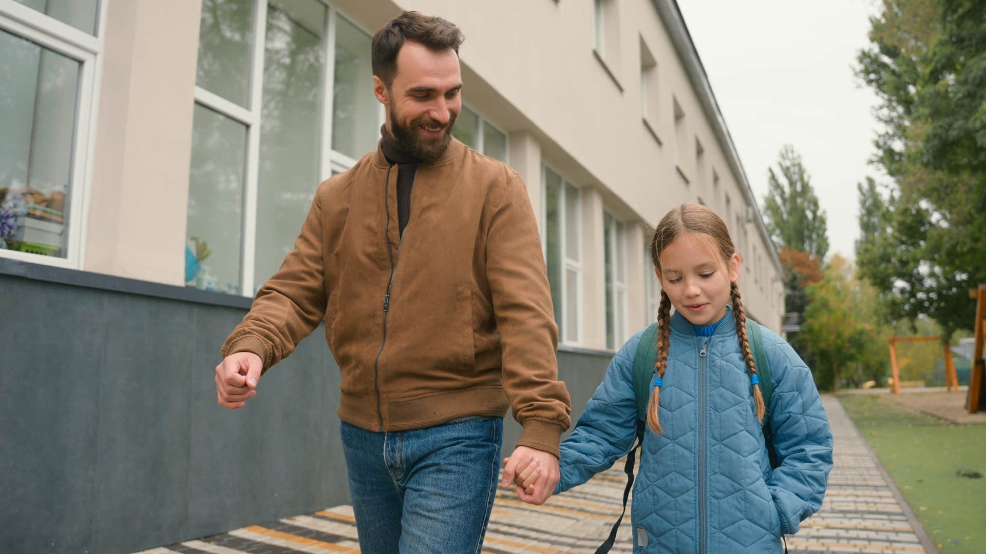 dad walking with daughter telling her she needs to handle her own problems