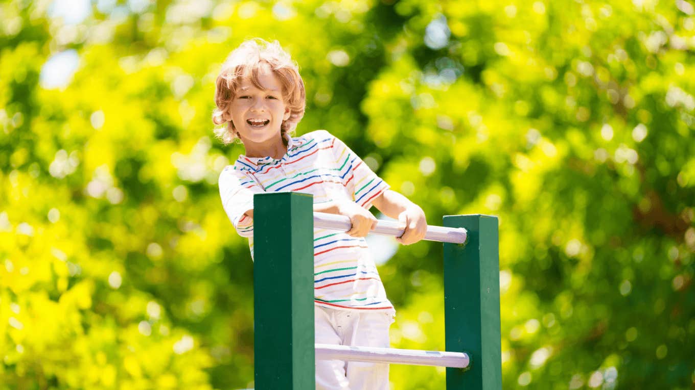 little boy playing outside
