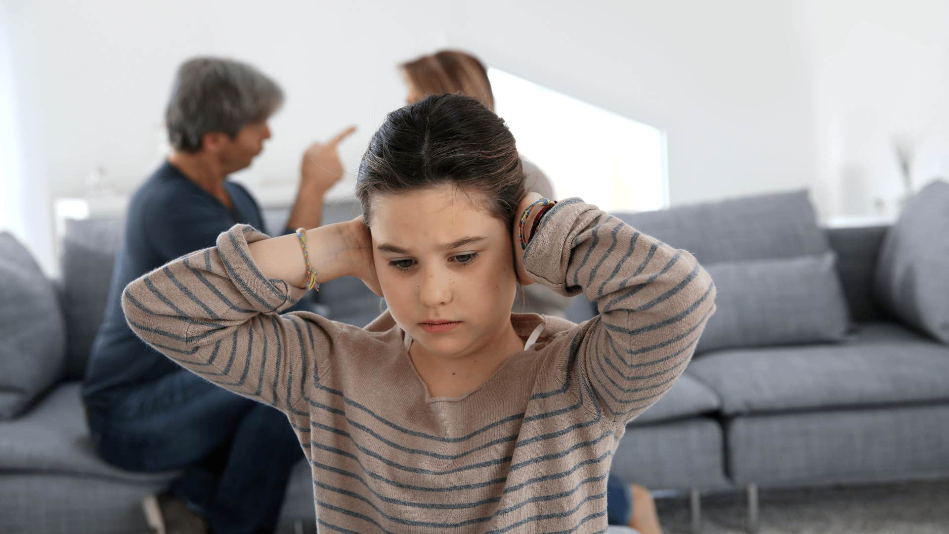 upset child playing the role of the benefactor in a narcissistic family