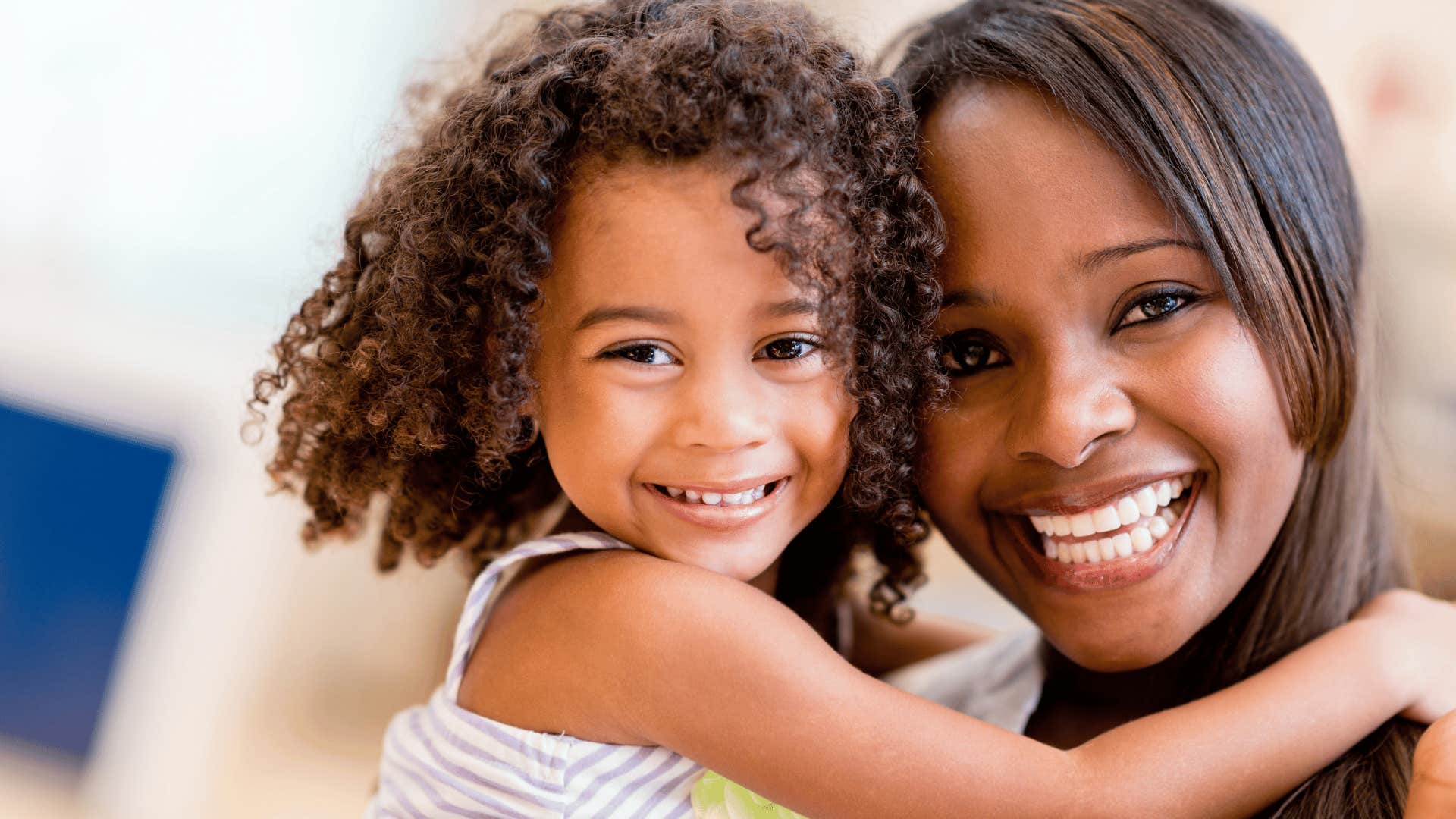 mother and daughter smiling