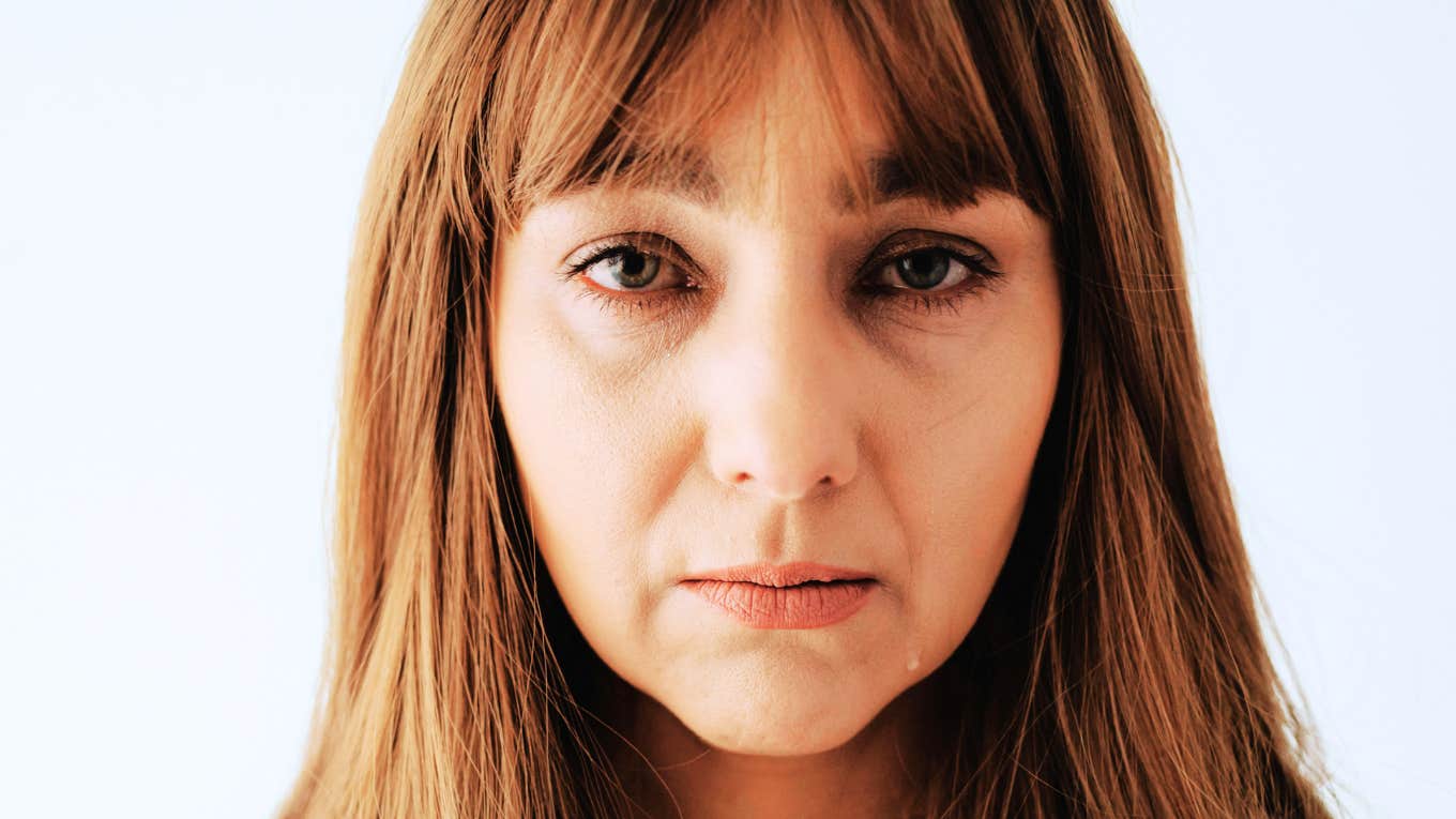 Are Your Parents the Problem? Habits That Mean It Might Be Time to Cut Ties Woman realizing her parents are the problem and needing to cut ties with them.